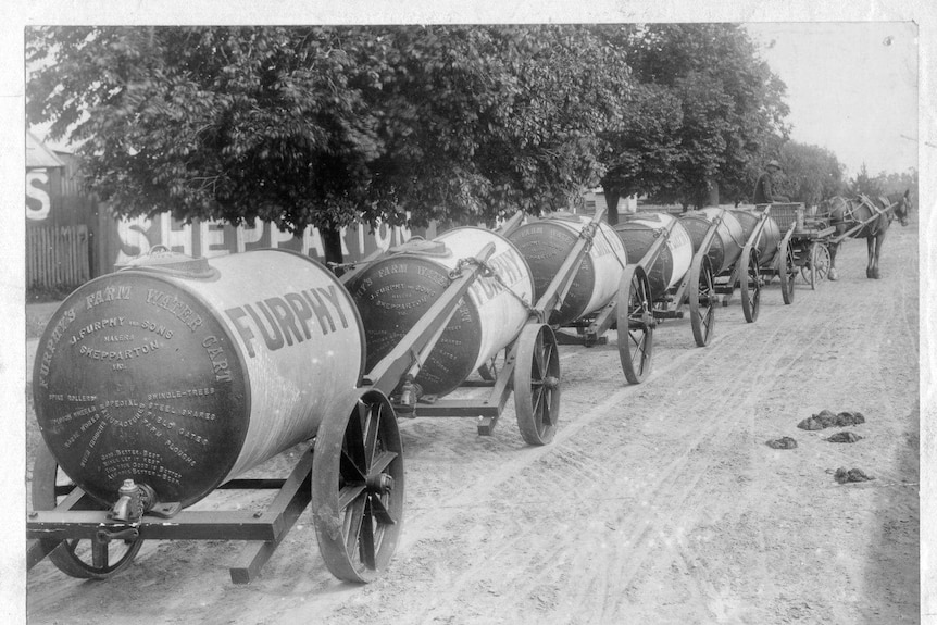 A line of furphy water carts