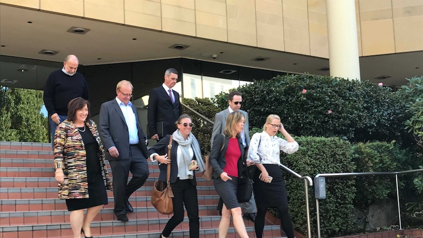 Team Huon leaves court.