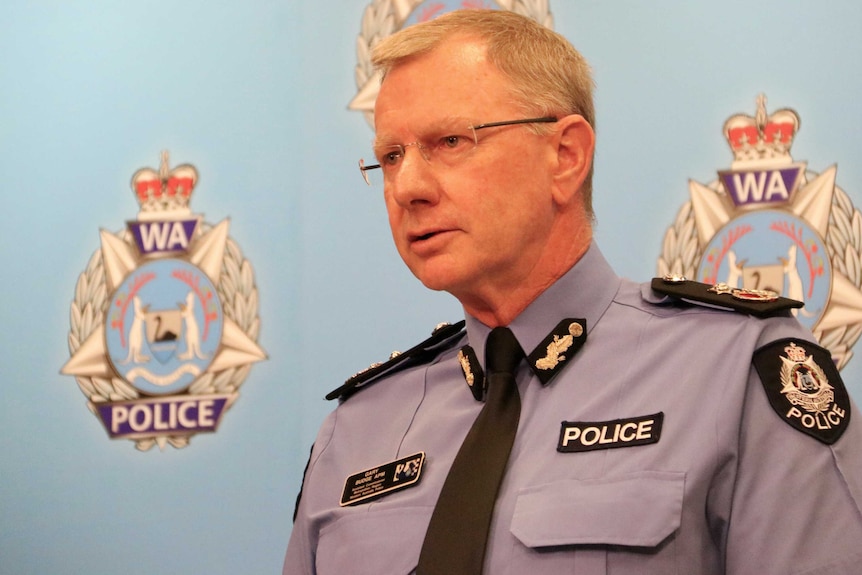 A head and shoulders shot of WA Police Deputy Police Commissioner Gary Budge speaking at a media conference.