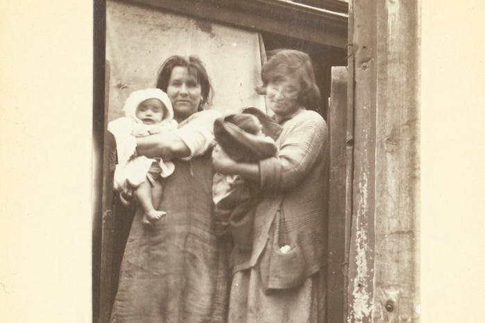 Sepia-toned historical photo shows two mothers living in Calrton in the 1930s.