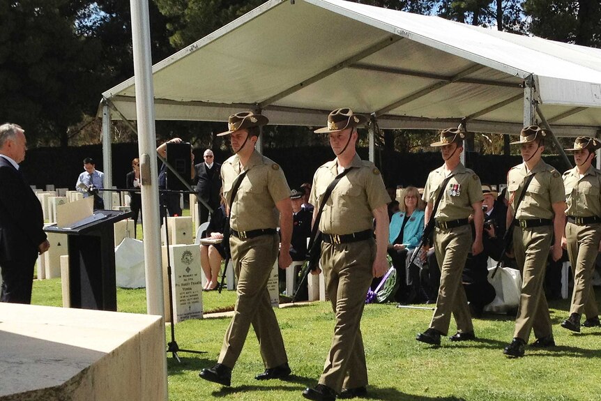 Soldiers take part in a Remembrance Day service in the military burial ground of West Terrace Cemetery in Adelaide.
