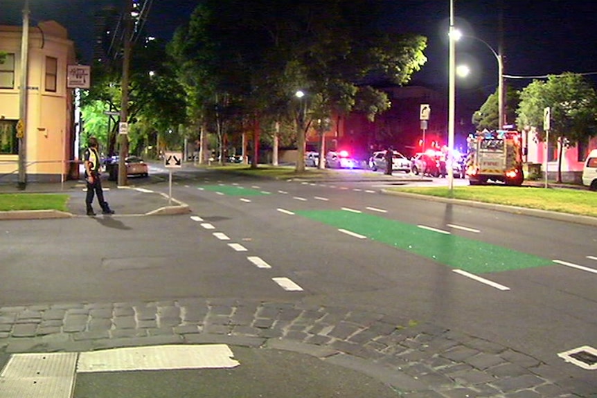 Police officers in a North Melbourne street.