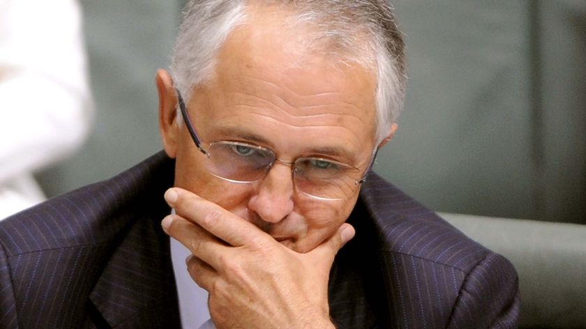 Opposition leader Malcolm Turnbull listens during question time