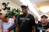 Former NBA basketball star Dennis Rodman arrives in North Korea surrounded by entourage and paparazzi.