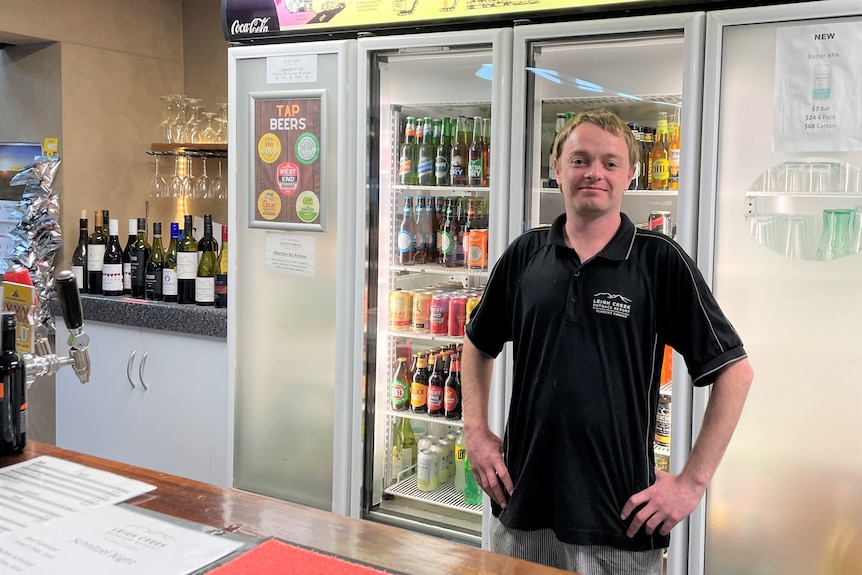 Leigh Creek resident and chef Ryan McClelland standing behind pub bar.
