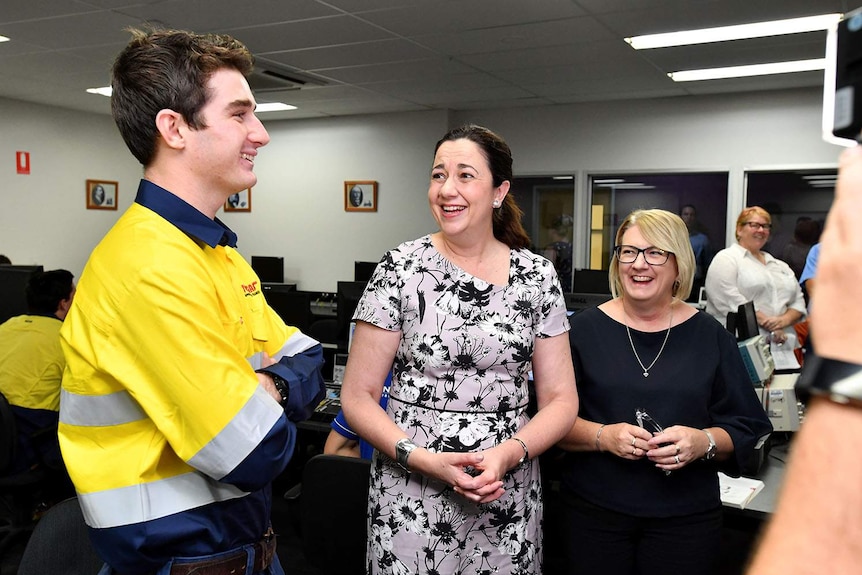 Annastacia Palaszczuk (centre) speaks to a trainee at the Townsville Trade Training Centre