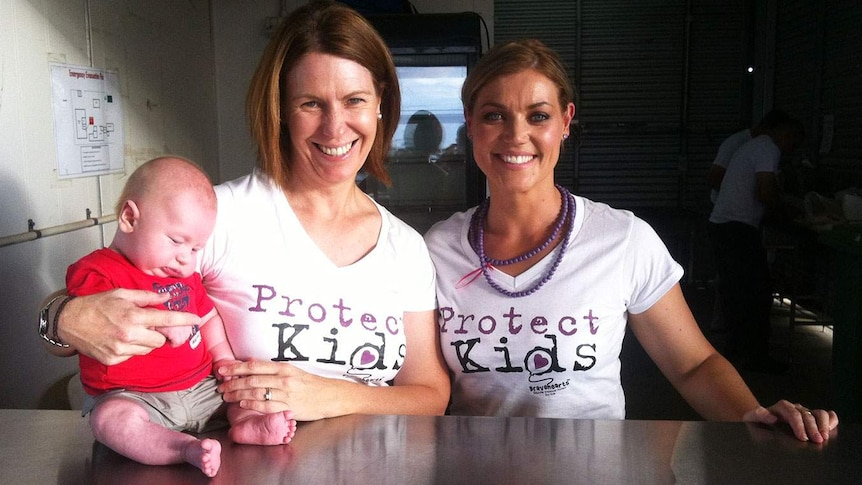 LtoR Belinda Murphy, with her six-month-old son Liam, and Linda McNab, from Julia Creek