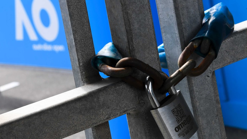 A silver padlock hangs around gates. The Australian Open logo is visible in the background