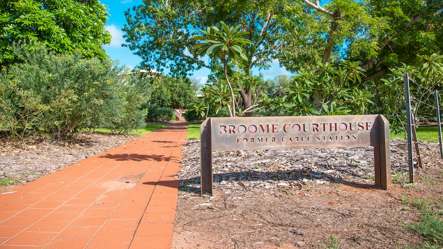 A sign outside the Broome Courthouse.