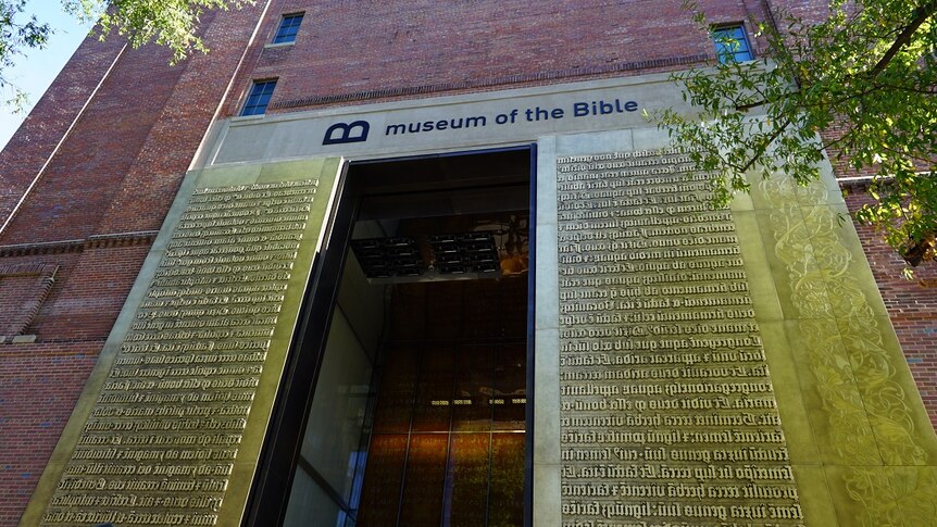 The entrance to the Museum of the Bible in Washington DC, with scripture around the door