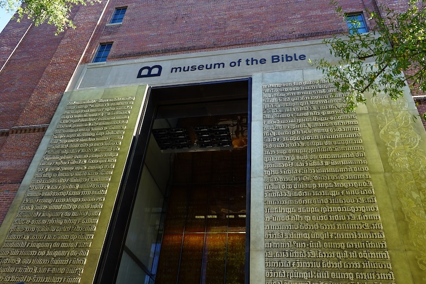 The entrance to the Museum of the Bible in Washington DC, with scripture around the door