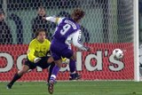 Fiorentina forward Gabriel Batistuta scores past Manchester United goalkeeper Mark Bosnich.
