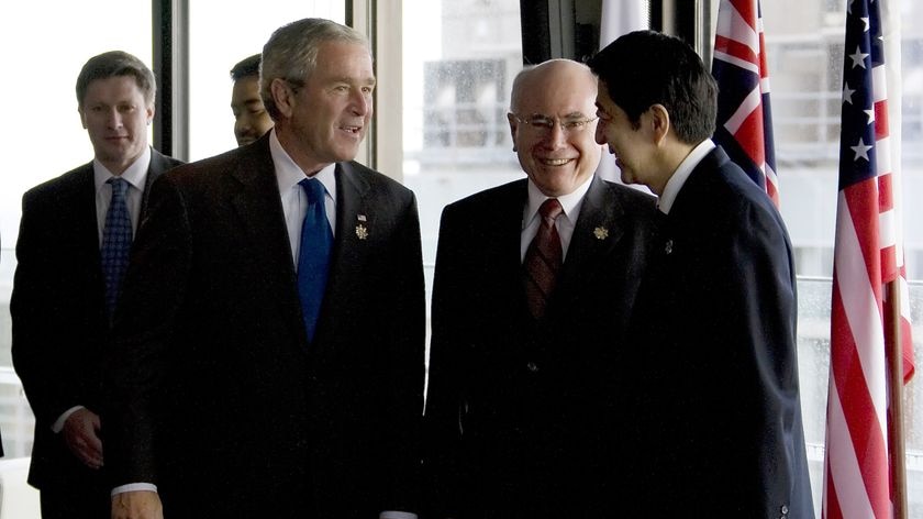 'Concert of democracies' ... US President George W Bush speaks with John Howard and Shinzo Abe during the APEC summit in Sydney. (File photo)
