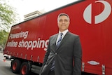 Australia Post chief executive Ahmed Fahour stands in front of an Australia Post truck.