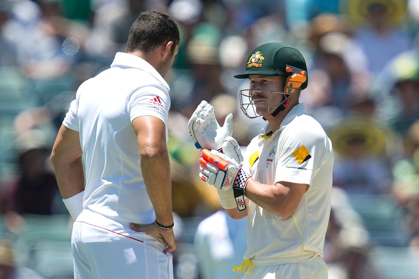 David Warner (R) and England quick Tim Bresnan exchange words during the 2013/14 Ashes series.
