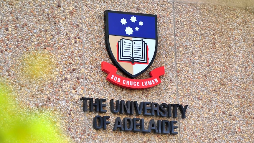 A sign showing the University of Adelaide logo