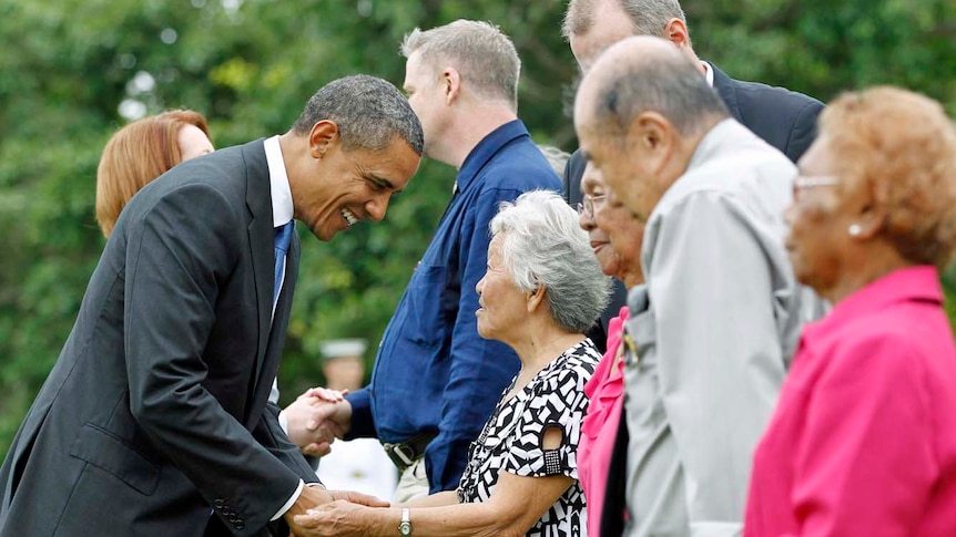 Barack Obama greets survivors of Japan's bombing of Darwin.