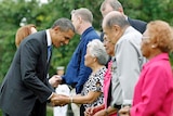 Barack Obama greets survivors of Japan's bombing of Darwin.