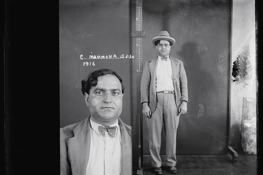 Side by side 1929 black and white mug shots of Guiseppe Mammone.  Closeup of Arthur's face and Arthur wearing hat, standing