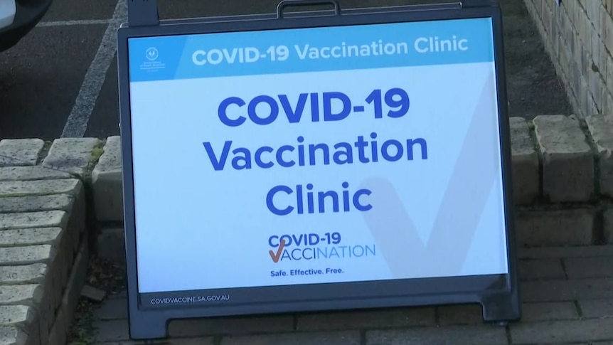 A sign on a computer screen saying COVID–19 vaccination clinic