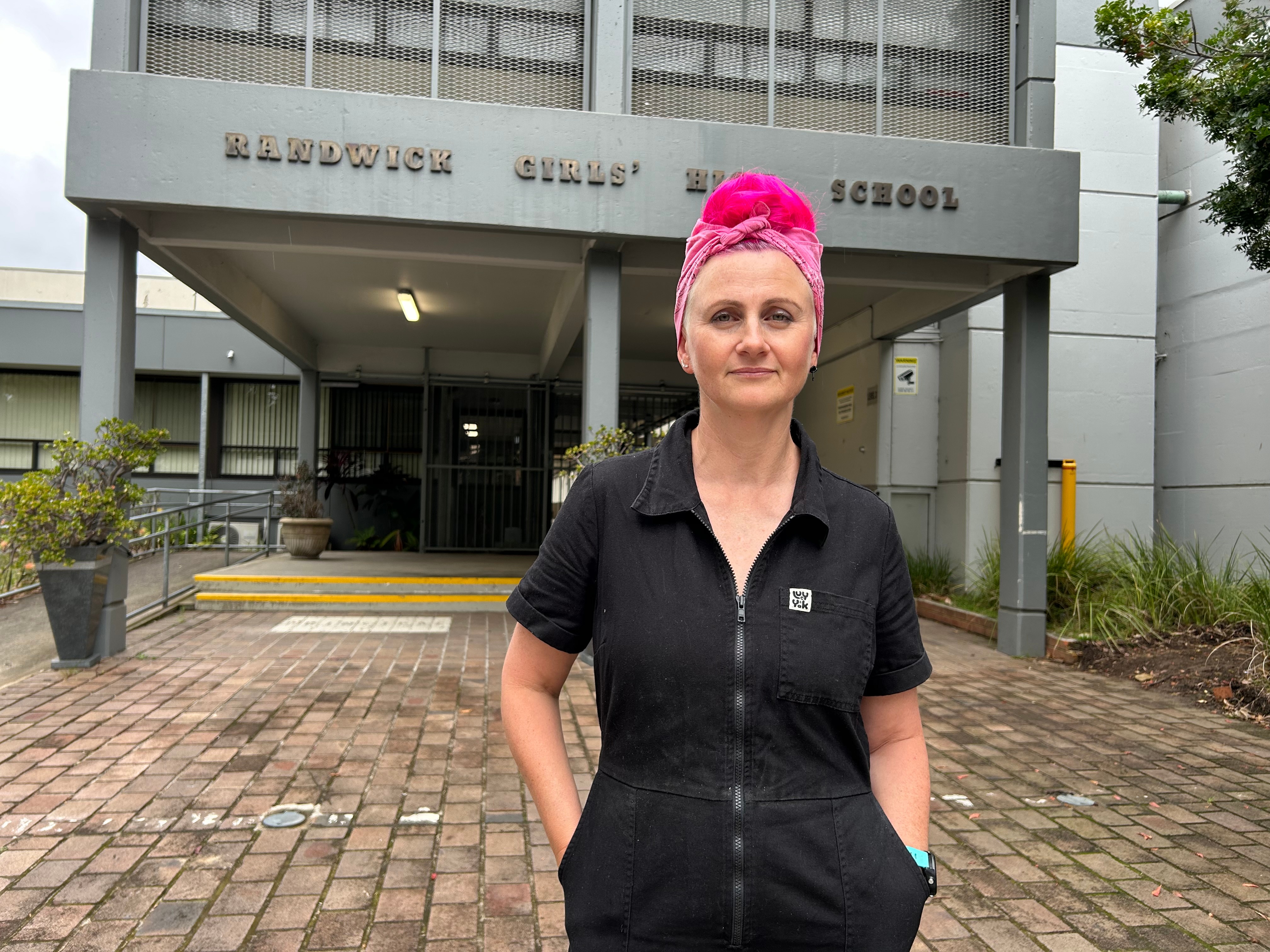mother lucy bloom standing outside randwick girls high school looking at the camera