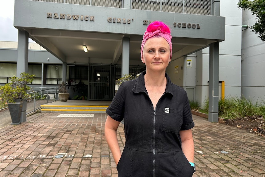 mother lucy bloom standing outside randwick girls high school looking at the camera