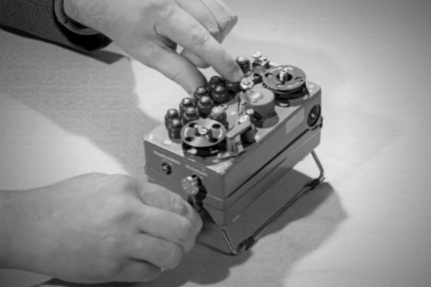 Black and white old photograph of a radio looking device that sent messages.