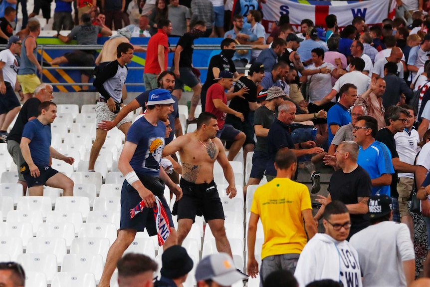 Fans face off in a football stadium