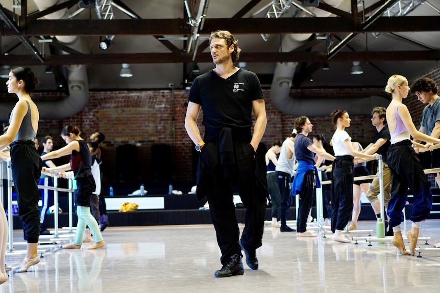 Aurelien Scannella walks amongst dancers