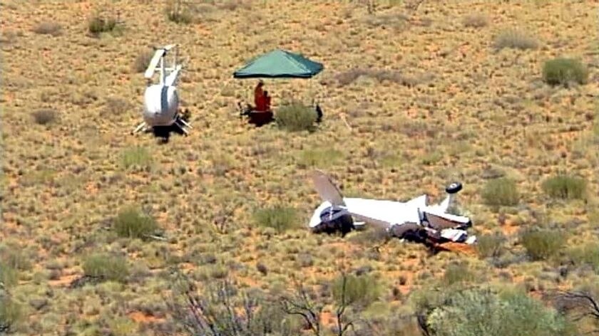 The wreckage of a light plane that collided with a helicopter