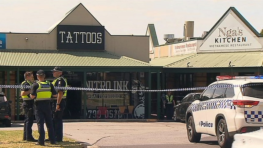 Police outside the tattoo parlour where a man was shot in Melbourne.