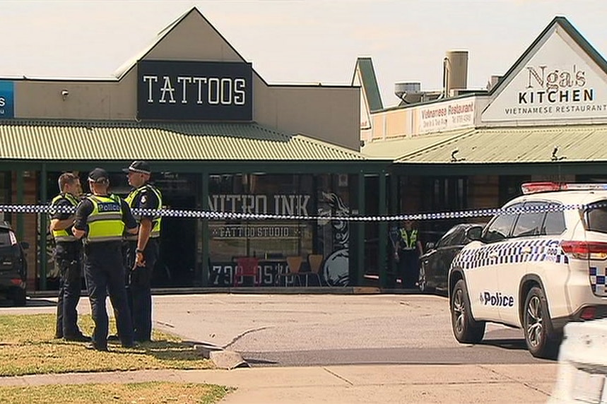 Police outside the tattoo parlour where a man was shot in Melbourne.
