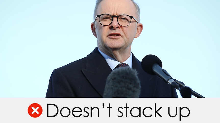 Anthony Albanese wears a black suit and glasses talking into a microphone. Verdict: Doesn't stack up with a red cross