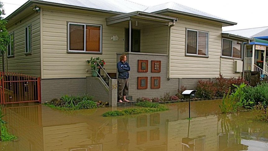 Man surveys floods