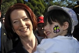 Julia Gillard holds four year old