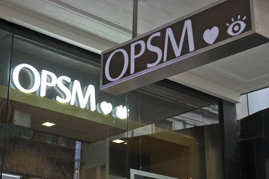 Store signs that say 'OPSM'.