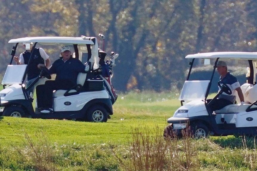 Donald Trump on a golf buggy
