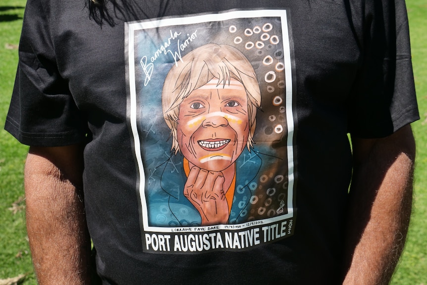 an illustration of a woman smiling on a mans t-shirt