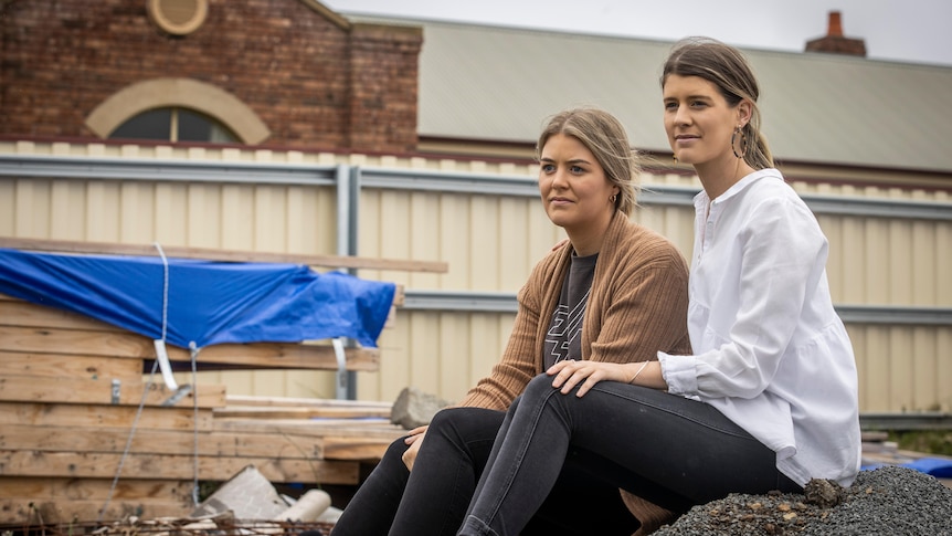 Sisters Maddy and Victoria Stansfield at their unfinished home.