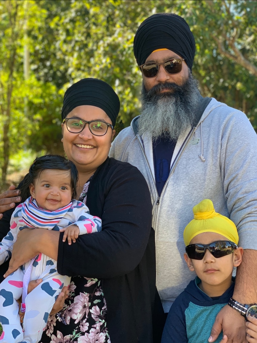 Amar with his wife, son, and baby daughter.