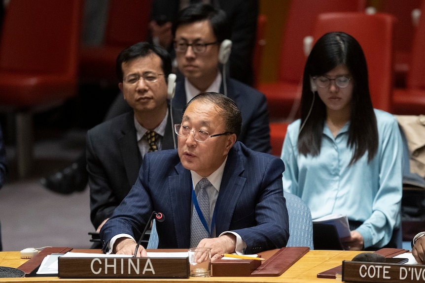 Chinese Ambassador to the United Nations Zhang Jun speaking into a microphone.