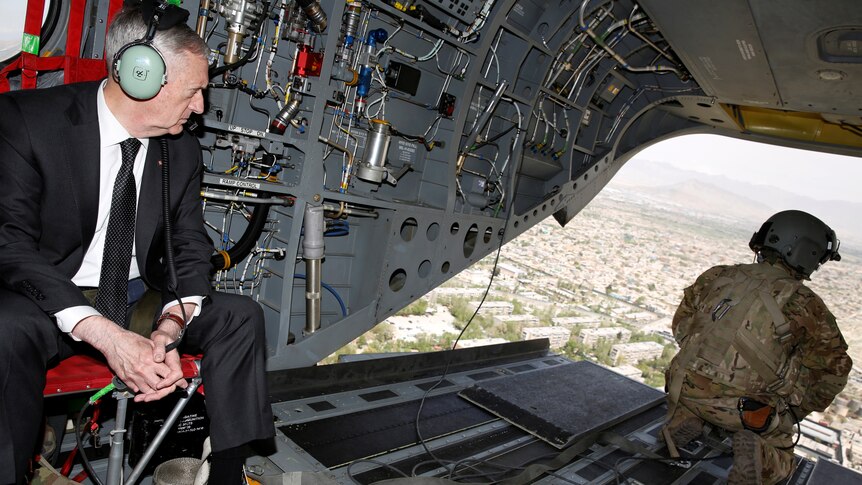 US Defense Secretary James Mattis looks out over Kabul as he arrives via helicopter.