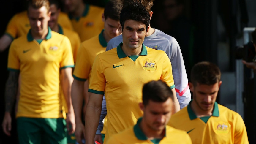 Mile Jedinak lines up for Socceroos team photo