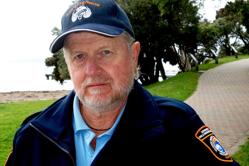 A head and shoulder shot of Albany Sea Rescue Squad operations co-ordinator Chris Johns standing outidoors on a footpath.