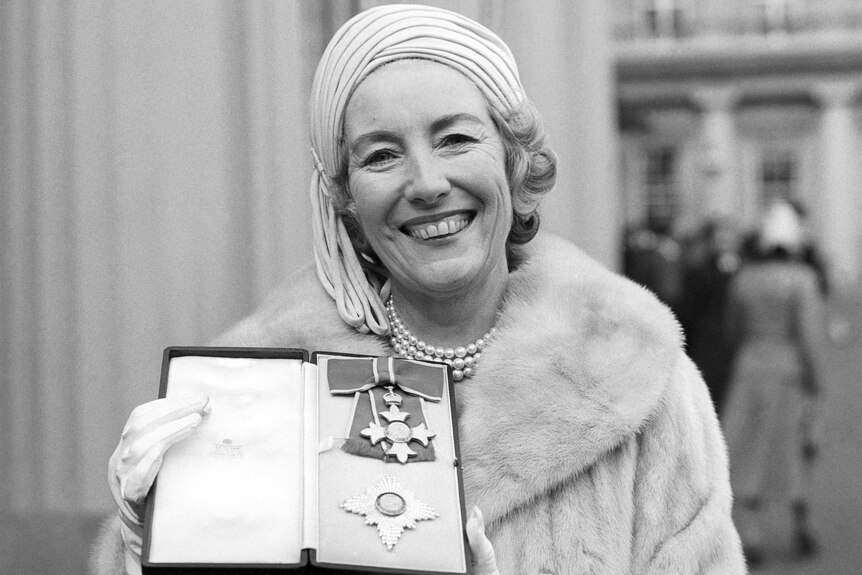 Vera Lynn poses outside Buckingham Palace after being invested a Dame Commander of the British Empire.