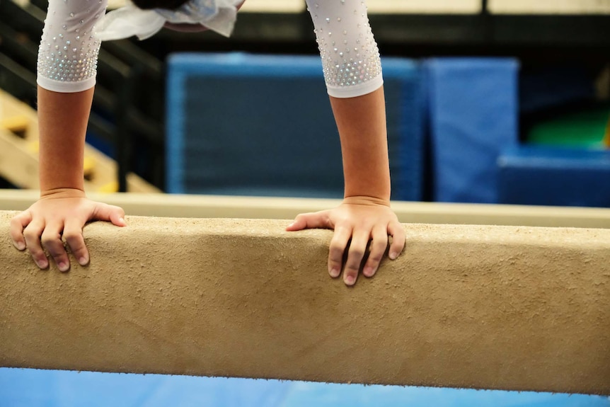 A gymnast trains