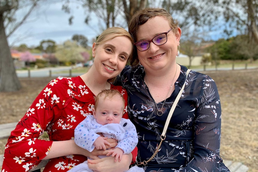 Same-sex couple Rebecca and Isabelle Sutherland with their baby