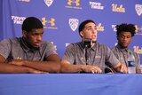 UCLA basketball players Cody Riley, LiAngelo Ball, and Jalen Hill speak at a press conference.
