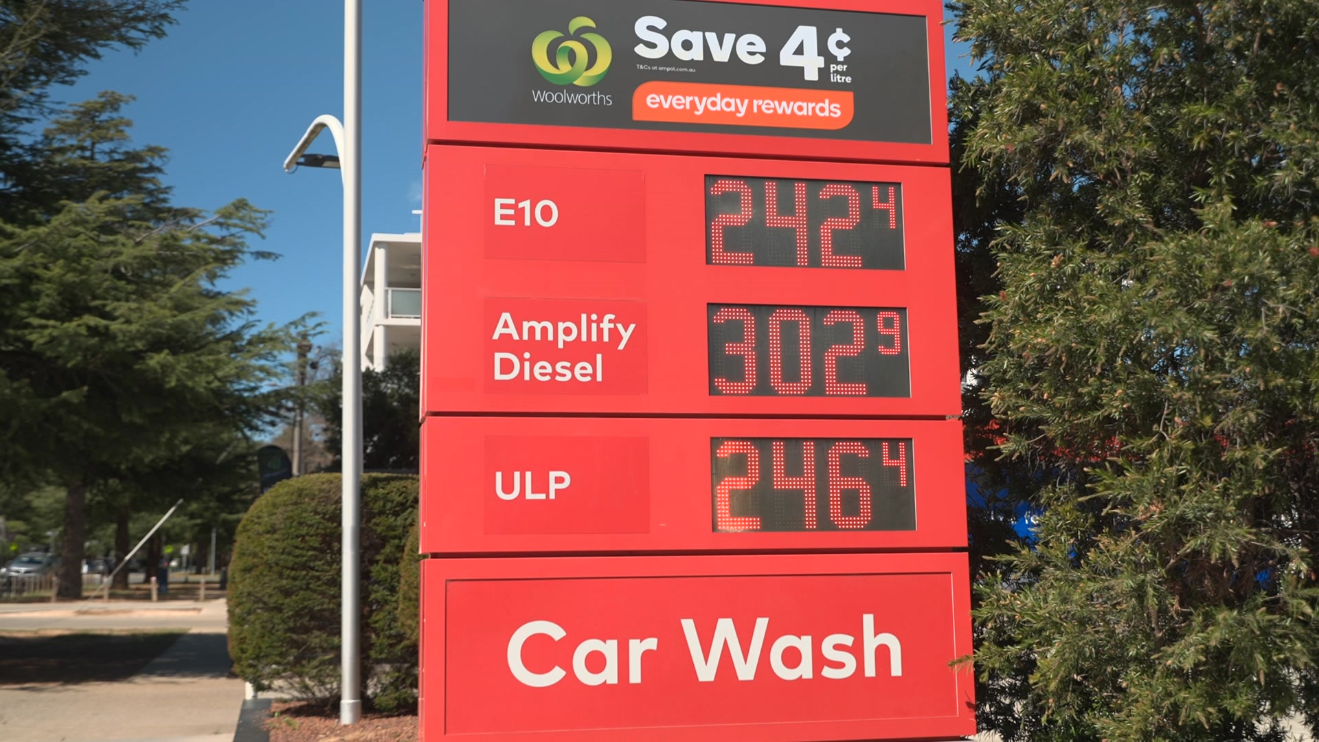 Fuel prices on a sign outside a petrol station, showing 242c per litre for E10.