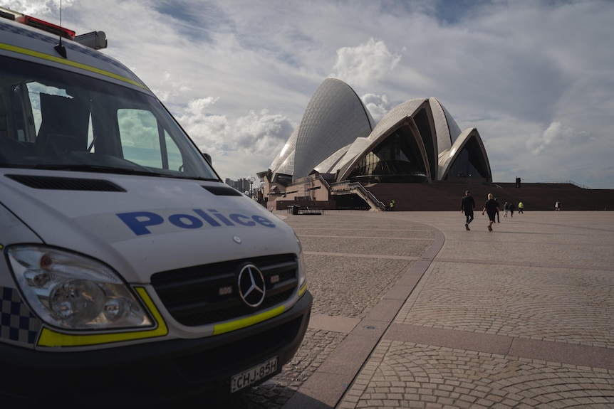 A NSW Police van is parked  in the forecourt of the Sydney Opera House
